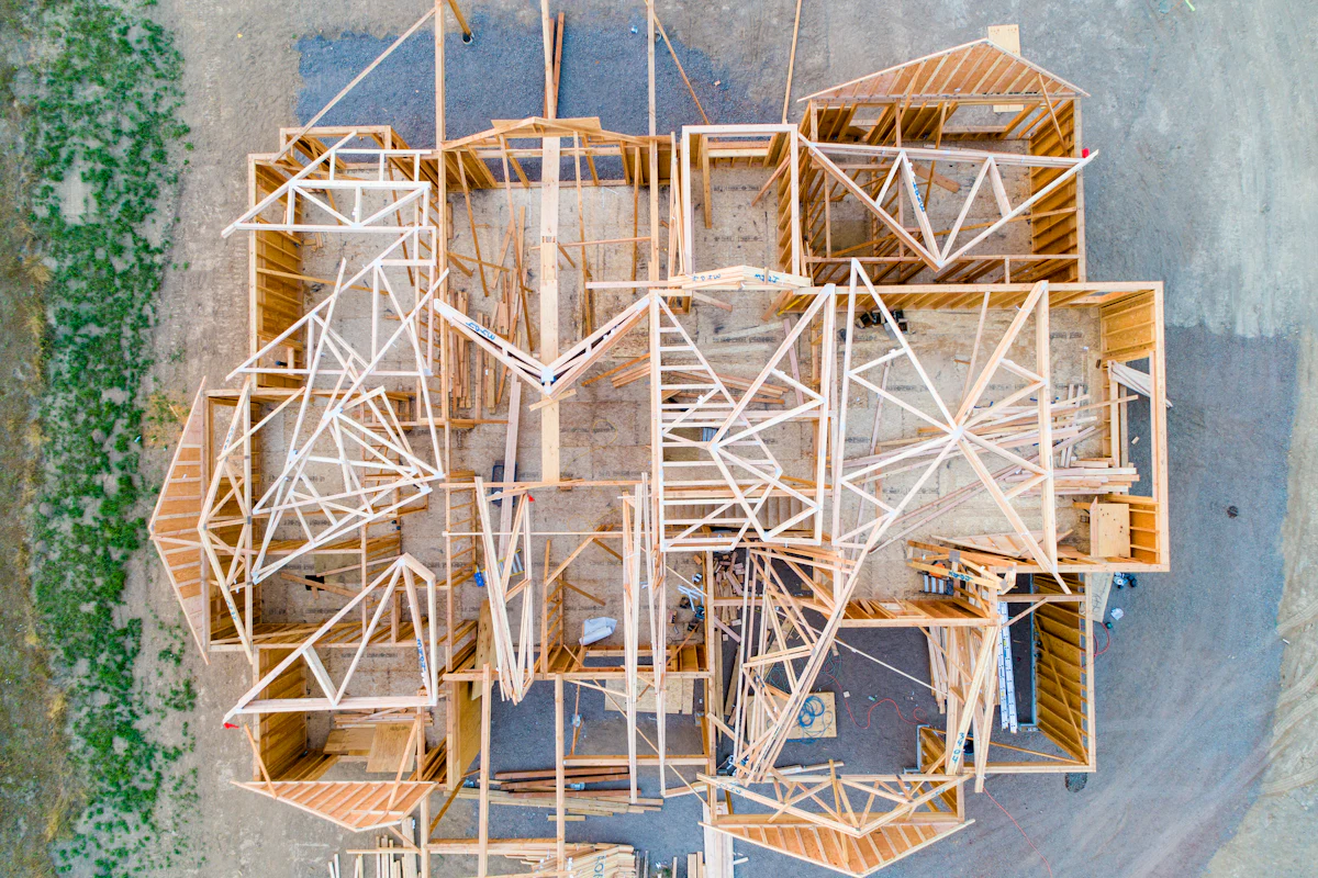 An overhead view of wood-framed walls showing the floor plan of a house